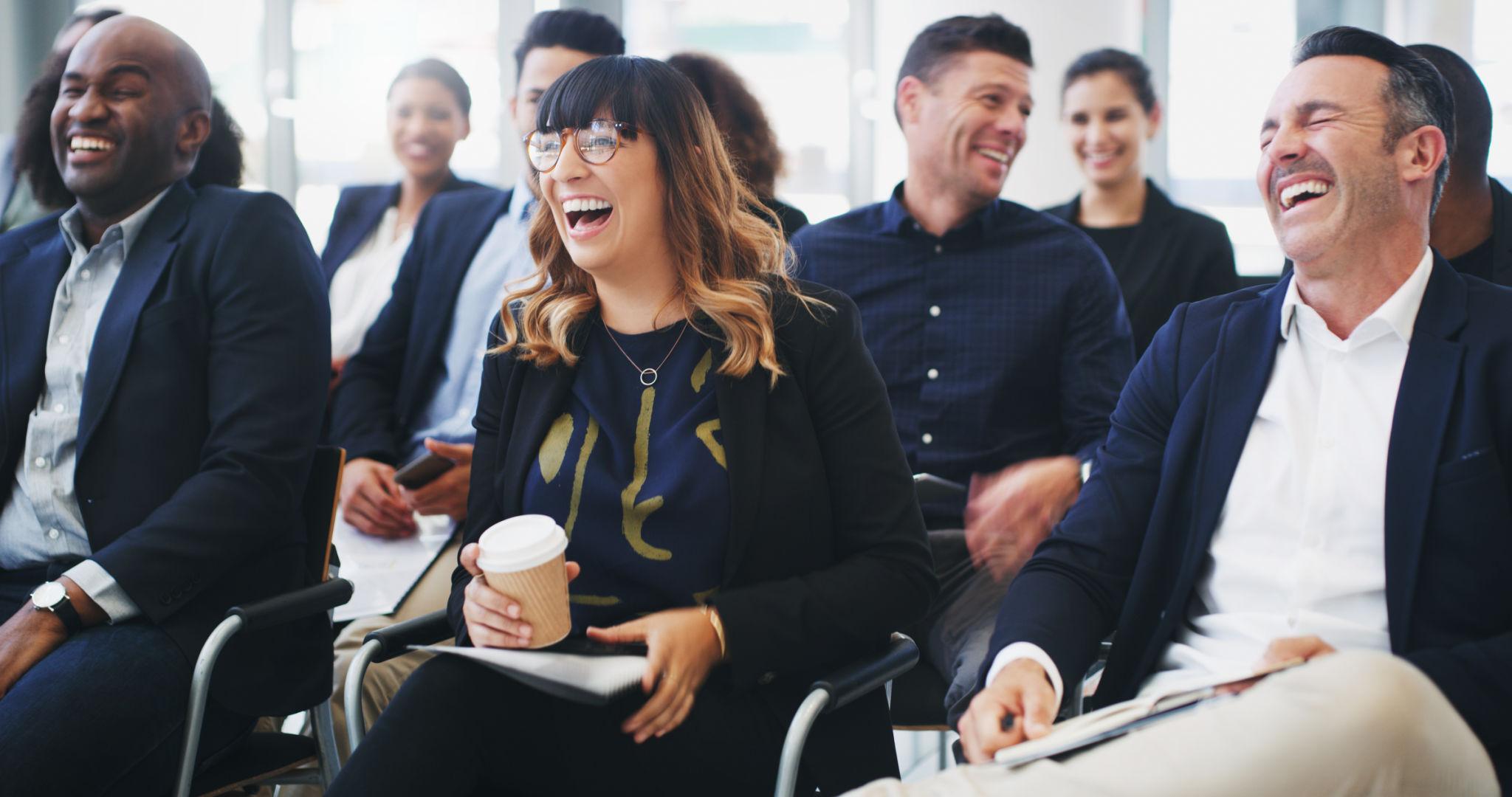Employee appreciation event entertainment with a mentalist engaging a group of coworkers