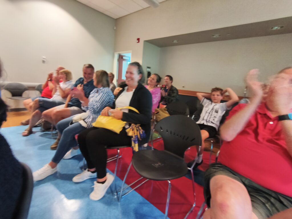 Guests enjoying magician and mentalist Nick Gasparro's performance at a birthday party in the Chicago suburbs