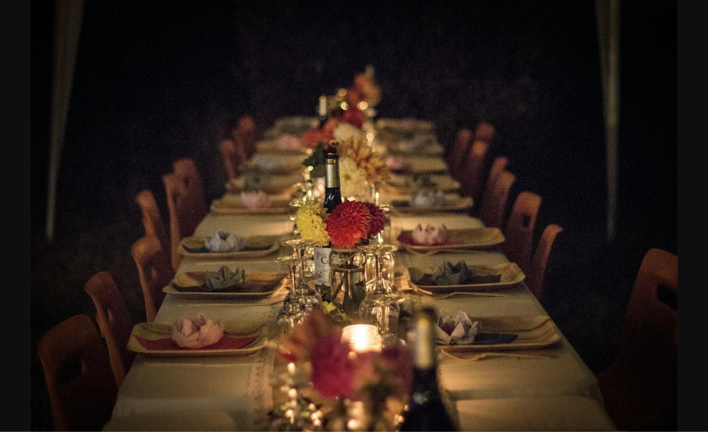 Elegant candlelit corporate dinner party table set for a holiday company party in the Chicago suburbs