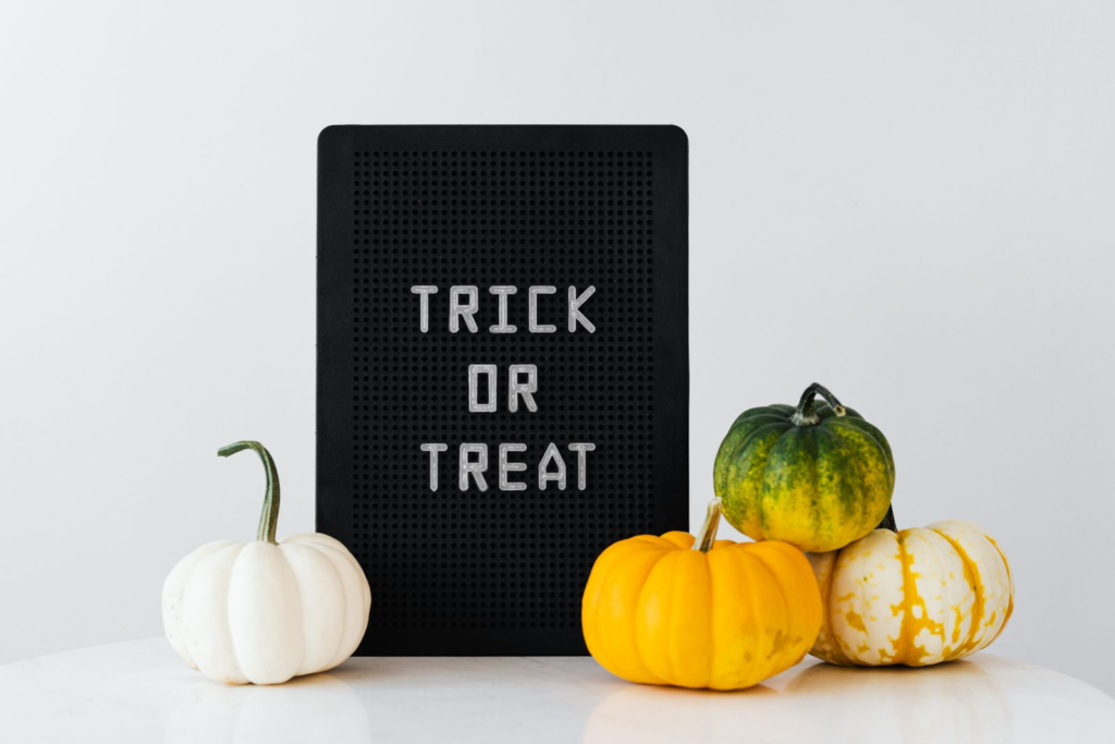 Halloween party magician entertainment theme: pumpkins with a Trick or Treat sign