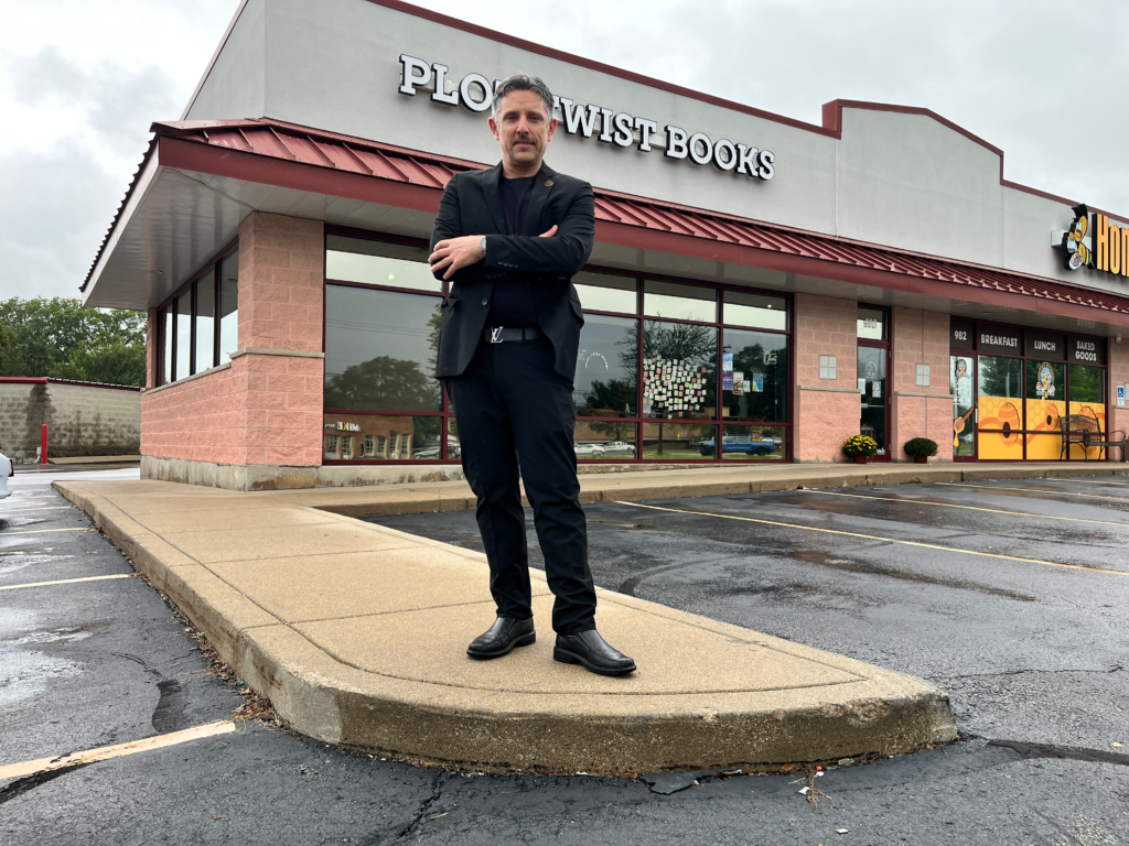 Mentalist Nick Gasparro standing outside Plot Twist Books in Lockport, Illinois, before his live show