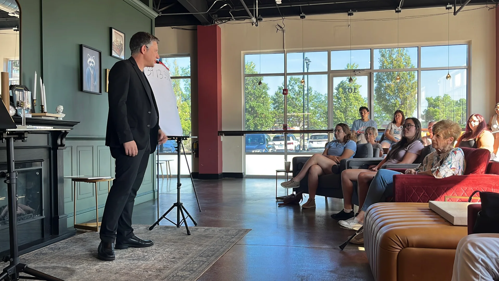 Magician and mentalist Nick Gasparro performing close-up magic for a group of adult guests