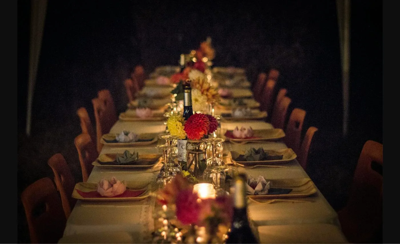 Elegant candlelit corporate dinner party table set for a holiday company party in the Chicago suburbs