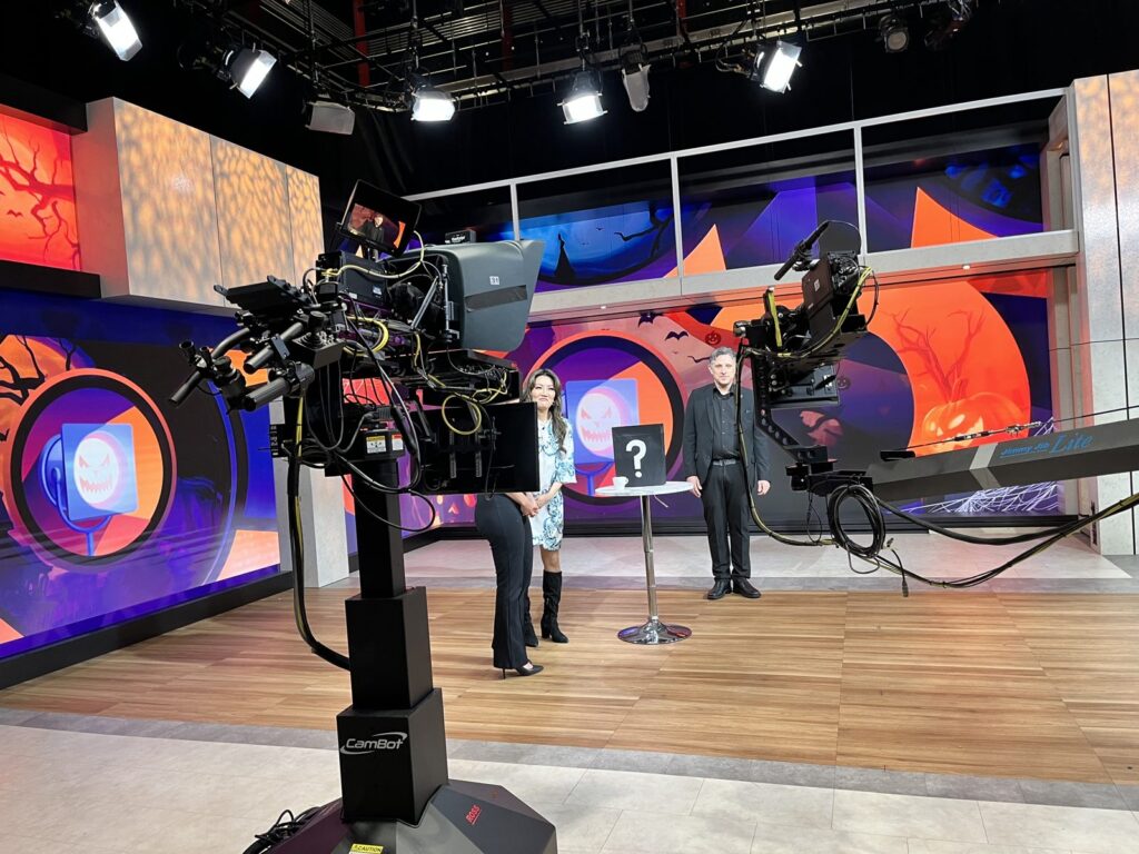 Wide view of the WGN-TV Spotlight Chicago set with mentalist Nick Gasparro and the show's hosts