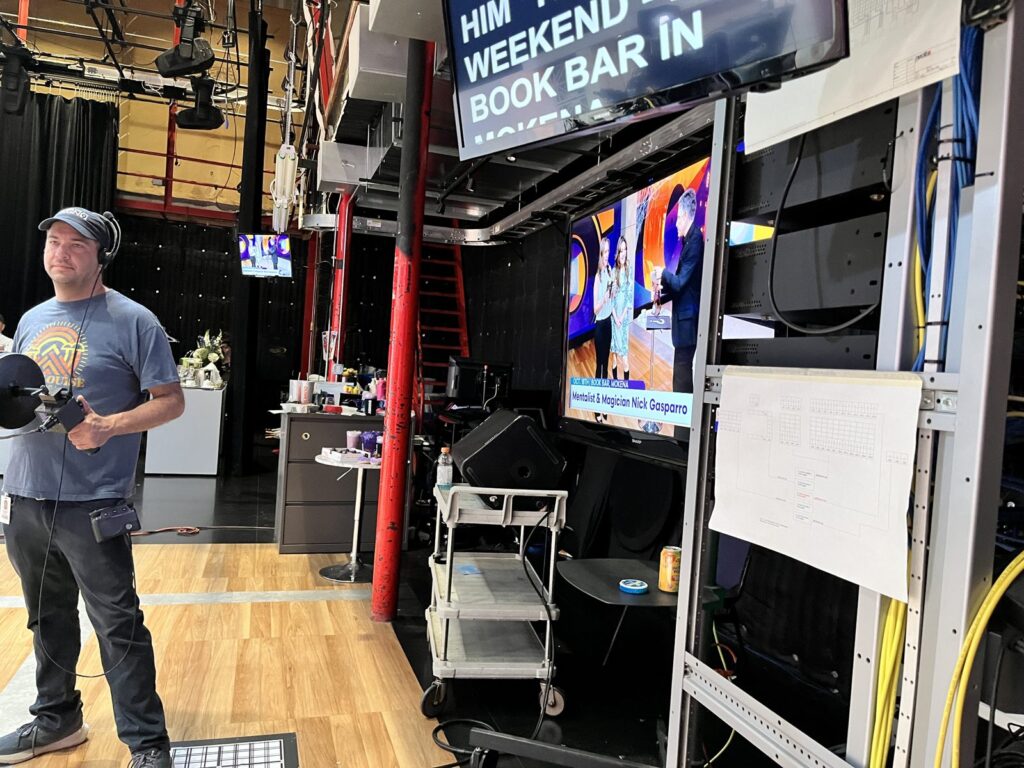 WGN studio monitor showing Mentalist and Magician Nick Gasparro live on Spotlight Chicago
